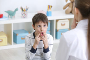 Cute little boy at speech therapist office